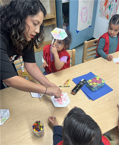 Parent teaching the spinner
